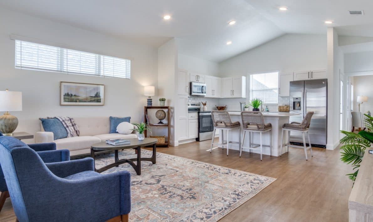 The open living room and kitchen of a cottage at LEO at Bethel Place