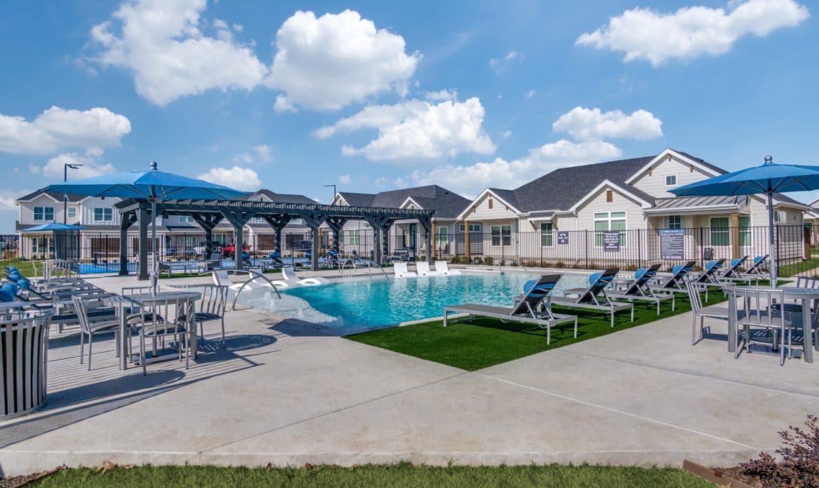 The pool, shade pergolas and cottages at LEO at Bethel Place